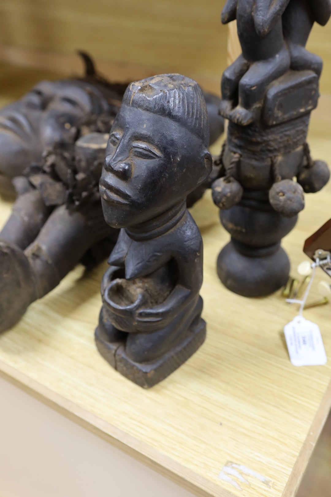 A group of Democratic Republic of Congo tribal carved wood figures and instrument and a Kuba style beadwork and shell mount mask